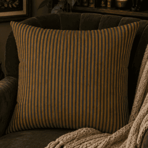 Vintage striped throw pillow featuring charcoal and antique gold ticking stripes inspired by classic dark academia and witch cottage décor.